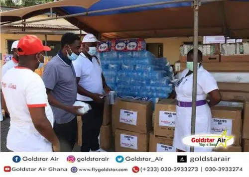 Goldstar Air Chairman/CEO Eric Bannerman, Kwaku Afful, and John Ashong-Mettle presenting mattresses, soaps, assorted drinks, personal protective equipment, sachet, and bottled water to Accra Psychiatric Hospital, received by Director of Nursing Services, Madam Agnes Agudu, and her team on behalf of Accra Psychiatric Hospital.